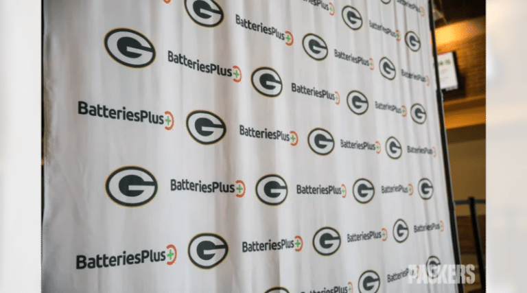 News 6 Step and repeat banner featuring the logos of the Green Bay Packers and Batteries Plus.